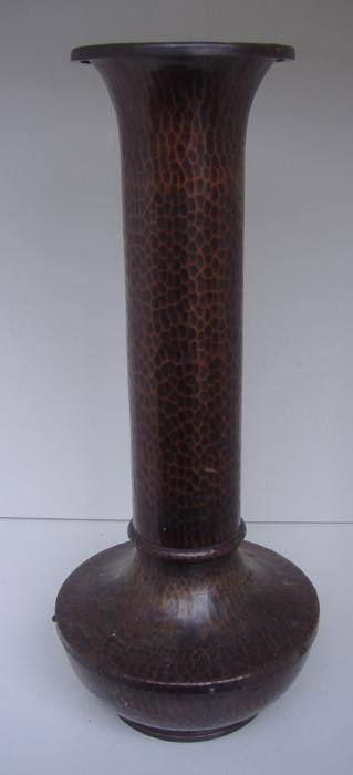 Roycroft Hammered American Beauty Vase 18.25" tall: Roycroft hammered copper American Beauty vase with deep brown patina measures 18.25" tall and 8" in diameter at the widest point on the body. Middle mark.