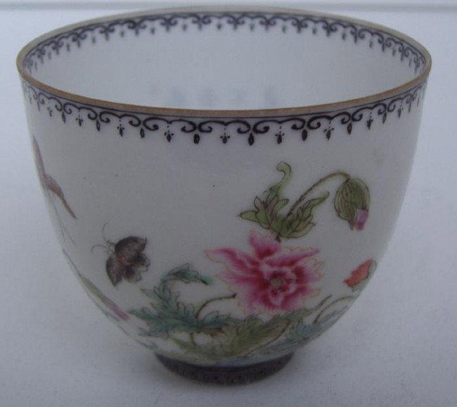 Chinese Egg Shell Porcelain Tea Bowl, signed: Well decorated Chinese egg-shell porcelain tea bowl measuring 2.25" tall and 2.5" in diameter. The bottom of the interior is decorated and the cup is signed underfoot in gold.