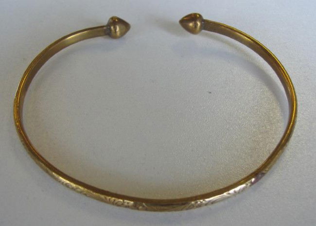 Gold Cuff Bangle Bracelet: Gold cuff bracelet with an etched floral design. The piece is marked 18CT (18 carat rolled gold over a base metal). Overall weight 12.5 grams.