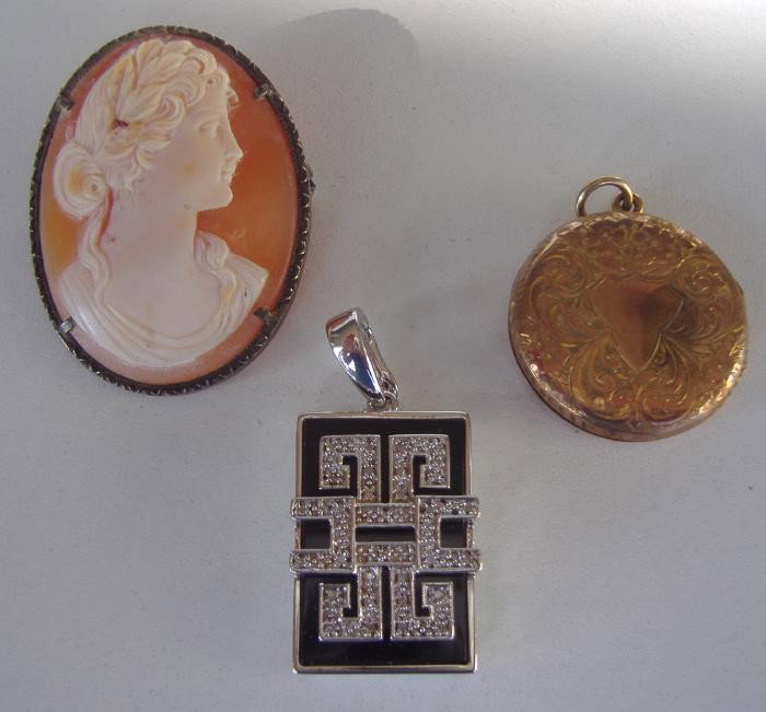 Carved Cameo, 14K Gold Locket & Chinese Pendant : Carved cameo brooch together with a gold locket and a sterling and onyx pendant. The locket is unstamped, although tests 14K gold. The pendant is marked 925, China.