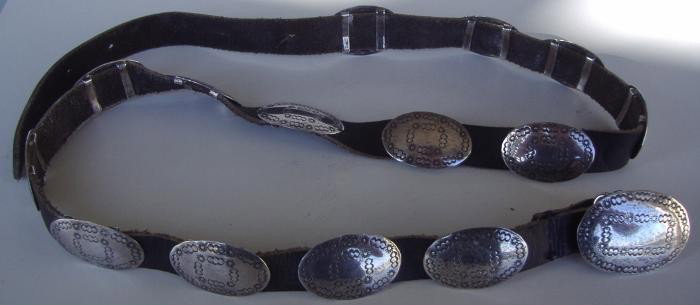 AMC Sterling & Leather Concho Belt: Sterling and leather concho belt. The buckle is marker AMC Sterling. Measures 36.5" long.