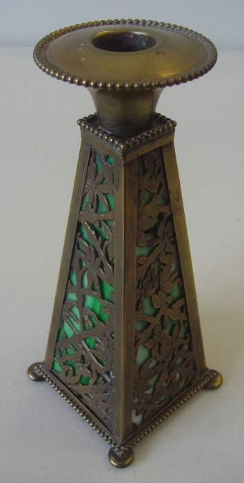 Apollo Studios Bronze & Slag Glass Candleholder: Rare candleholder of bronze and green slag glass panels. The candle holder measures 7-5/8" tall. Marked on the underside Apollo Studio, New York. NOTE: one panel cracked and one panel missing a small