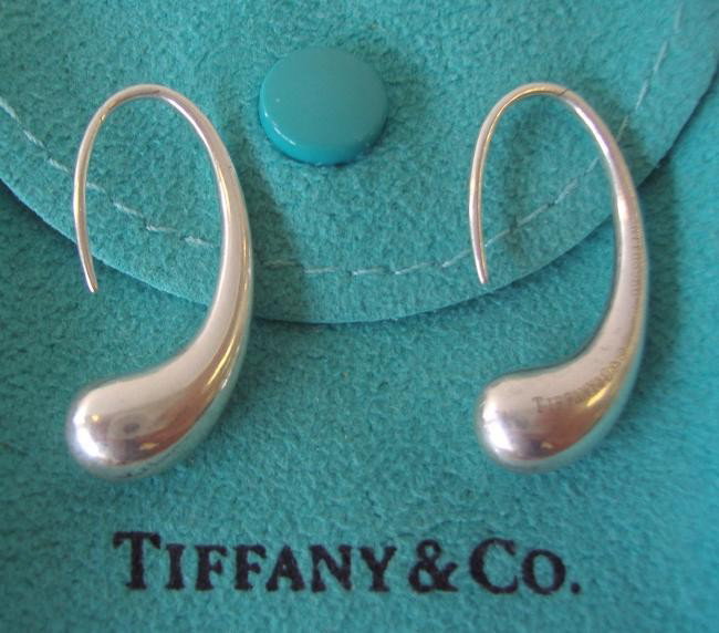 Tiffany & Co Sterling Earrings by Elsa Peretti: Pair of Tiffany & Co sterling earrings in a tear drop design with original pouch. Both earrings are hallmarked Tiffany & Co. Elsa Peretti 925 Spain.