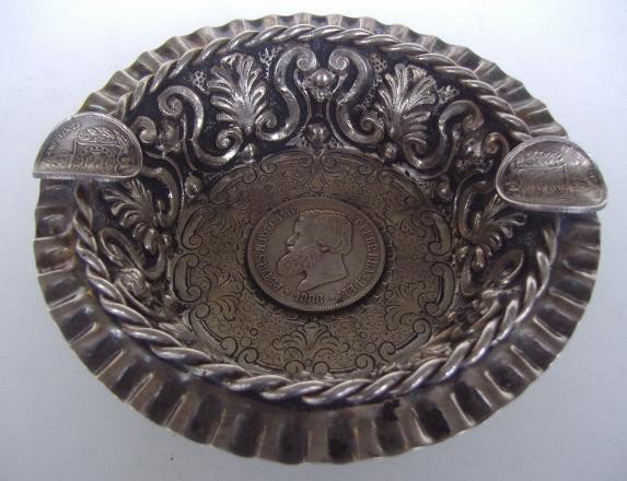 Brazilian Silver Cigar Tray with Dom Pedro Coin: Brazilian silver cigar ash tray bowl with swag and leaf motif. The coin in the center of the ash tray features a bust of Emperor Dom Pedro II (b1825-d1891). The Latin legend PETRUS II D.G.IMP. ET PERP