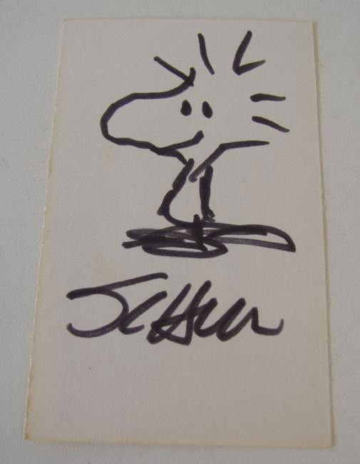 Peanuts Charles Schulz Signed Drawing Woodstock: Charles M. Schulz signed drawing of the Peanuts character Woodstock. The drawing is done on the back of a name tag measuring 4" x 2.5". See photos for the front side of the card.