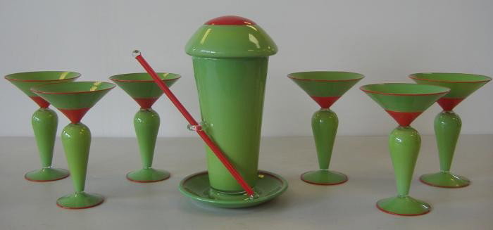 Boyd Sugiki Hand Blown 8 piece Martini Set: Eight piece martini set by Seattle glass artist Boyd Sugiki. The "olive/pimento" inspired set includes six martini glasses, a cocktail shaker with lid and a glass stir stick.