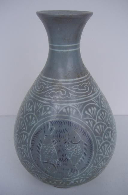 Asian Fish Decorated Porcelain Vase: Overall fish scale design with three roundels decorated with two fish each. Measures 9.5" high.