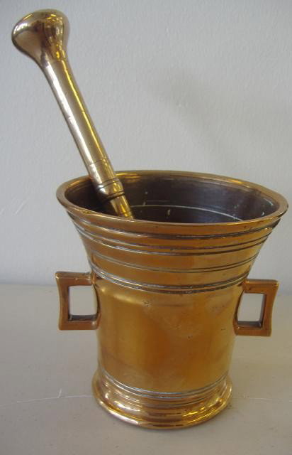 18thc Handled Bronze Mortar & Pestle, signed: Initialed FFO. The piece measures 5" high and 5" in diameter. The pestle measures 9.75" long.