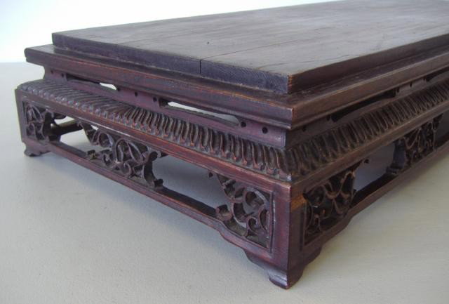 Chinese Carved Wood Stand or Low Table: The well carved piece measures 24" long, 10.5" wide and 3.5" high.