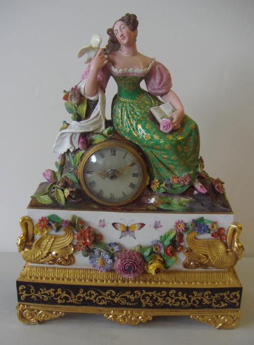 19thc Jacob Petit Paris Porcelain Figural Clock: This porcelain piece measures 15.5" high, 12" wide and 4.5" deep. The underside is signed with the Jacob Petit mark (see photos). The clock works have been replaced with an electric clock. NOTE: repai