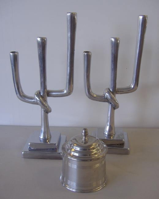 2 Silver Modernist Candelabra & a Stieff Humidor: Two silvered metal Modernist 3-branch candelabra measuring 16.5" high. Together with a Stieff pewter covered canister or tobacco humidor, measuring 5.5" high to the top of finial