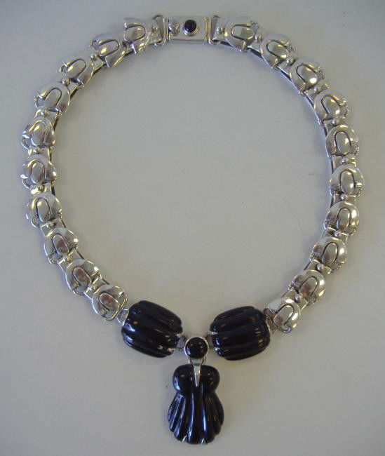 Sterling Modernist Necklace, Bernice Goodspeed: Modernist sterling and obsidian necklace marked with silver purity of .970 and Mexico. On the backside of the largest carved obsidian it is marked 970, Mexico and a Maker's mark of GJ for Bernice Good