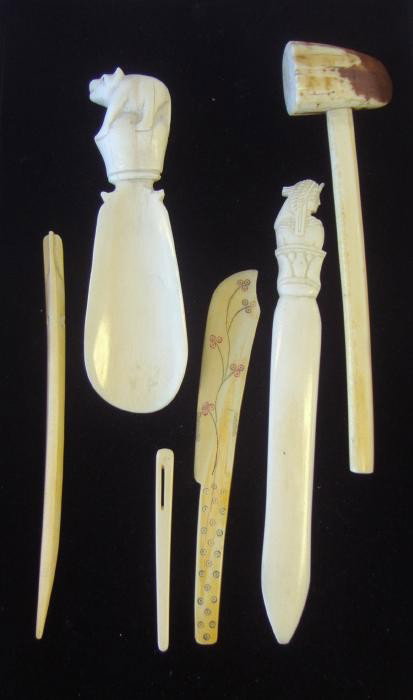 Alaskan Ivory Mallet, Shoe Horn, Letter Opener etc: Carved ivory shoe horn together with a mallet, two letter openers and two utensils.