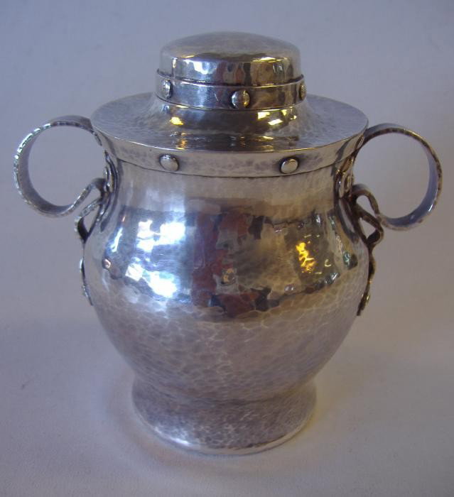 Hammered Arts & Crafts Sterling Tea Caddy: Sterling Arts & Crafts sterling tea caddy measuring 4.5" high. The underside is marked Sterling, Black Starr & Frost, New York and has a Maker's mark showing a Leopard within a cartouche. Weighs 7.47 