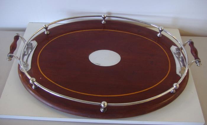 Mahogany & Sterling Serving Tray, England, 1907: Mahogany and sterling serving tray with satin wood inlay measuring 22" from handle to handle and 15" wide. Hallmarks for Sheffield, England, John Round, 1907.