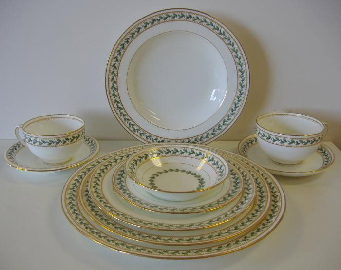 Mintons for Tiffany Dinner Set, Holly & Berry: Large set of Mintons for Tiffany & Co, china in a holly and berry pattern, H576,with raised gold beading. Approximate service for 12. Comprised of 11 dinner plates, 12 luncheon plates, 11 salad or des