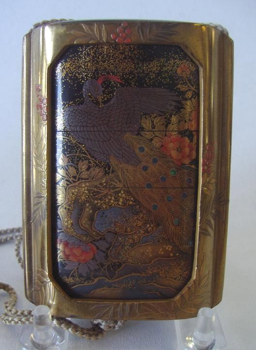 Japanese 4-Case Inro, Sheath & Ivory Netsuke: Four-case Japanese Inro with exceptional design front and back. The inro fits into a lacquered sheath, with a cord attached to a carved ojime and carved ivory netsuke in the form of a foo lion with ba