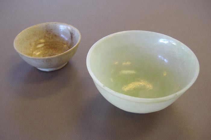 Chinese Jade Bowl & Earthenware Bowl: Translucent jade bowl measuring 3" in diameter and 1.5" high, together with a small earthenware bowl measuring 2-3/8' in diameter and 1" high.