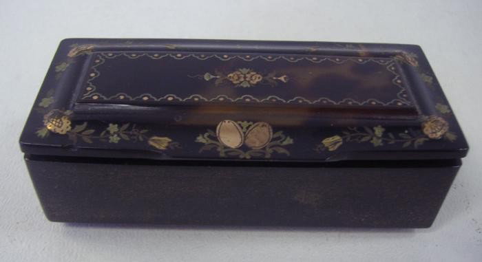 19th Tortoiseshell Snuff Box: 19thc tortoiseshell snuff box with enamel painted decoration. The snuff box measures 3.25" x 1-3/8" deep and 1" high.