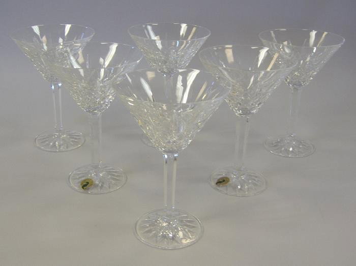 Six Waterford Lismore Martini Glasses: Set of six martini glasses by Waterford in the Lismore pattern. Measuring 6-5/8" high. All signed, some with original paper label. Very good overall condition. No chips.