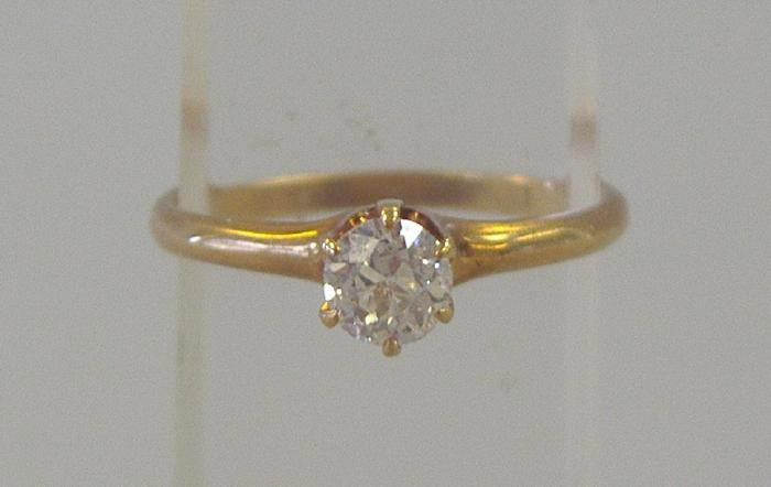 Diamond & 14K Gold Solitaire Ring: One European-cut diamond approximately .26 carat measuring 4.2mm x 4.08mm in diameter and 2.53mm in depth. The clarity is I1 and G color, as graded in the mounting. The diamond is in a 6-prong 14K gol
