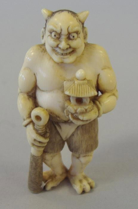 Japanese Carved Ivory Netsuke of a Devil, signed: Carved ivory and polychromed figural netsuke of a devil. Measures 2-1/8" tall.