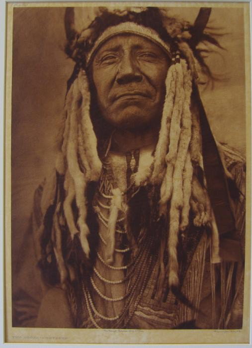 EDWARD SHERIFF CURTIS Two Moons Cheyenne on Tissue: Edward Sheriff Curtis (1868-1952), "Two Moons Cheyenne" Plate 213, Photogravure, John Andrew & Son. Loosely mounted (top and bottom corners). Measures 17-3/16" x 12.25". Framed measurement 24.25" x 20