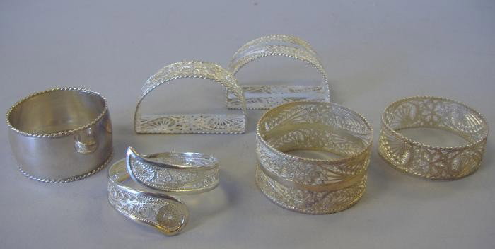6 Sterling & 950 Silver Filigree Napkin Rings: Five .950 stamped silver filigree napkin rings together with a .925 sterling napkin ring. Overall weight of the six, 2.27 troy oz.