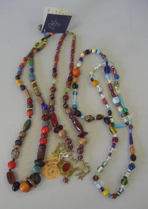 Three Multi Stone Necklaces, Jade, Carnelian, etc: Beaded necklace with an etched brass deer set with a carnelian, together with two additional multi-beaded necklaces. See photos for further description.