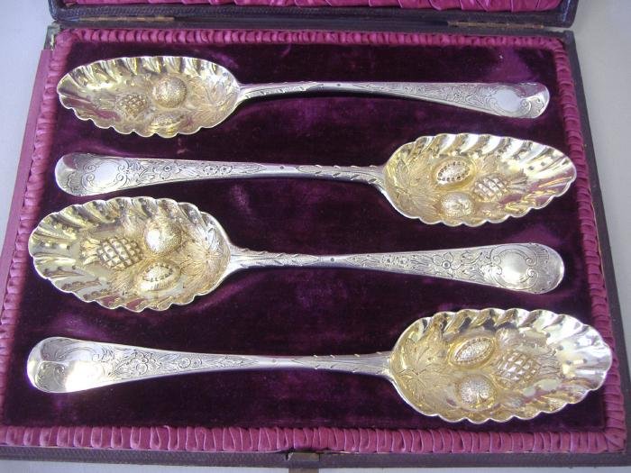 4-18thc English Berry Spoons, Pineapple Motif: Set of four 18th century bottom marked berry spoons with gilt-washed bowls. Each having the same pineapple motif and etched designs. Various Makers; TE over GS, W over WS, AB and one indistinct Maker'