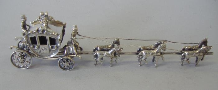 Cartier Dutch Holland Silver Miniature Carriage: Dutch silver miniature horse drawn carriage. The underside is marked Cartier (retailed by) and Holland. Measures 6.5" long, 1" wide and 1.75" high.