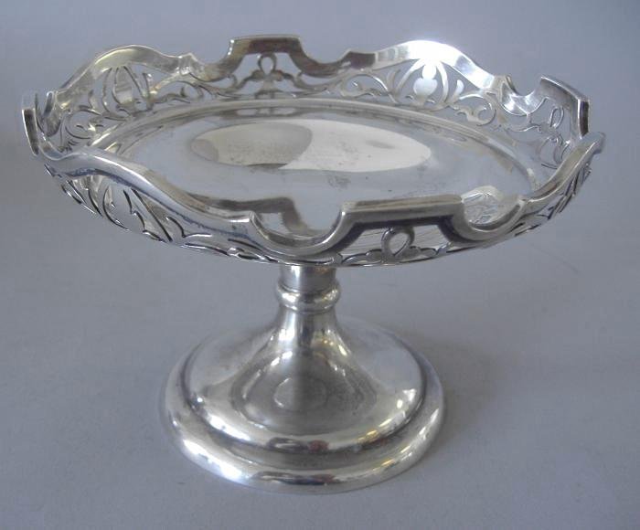 Sheffield Sterling Candy Dish Compote: Sterling footed compote or candy dish with open-work sides. Hallmarked for Sheffield, England, Martin Hall & Co, 1909. Measures 6" in diameter and 4" high. Weighs 9.78 troy oz.