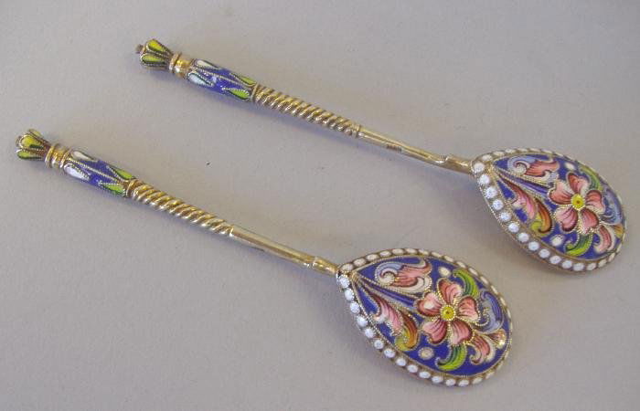Two Russian Gilt Silver & Cloisonne Enamel Spoons: A pair of Russian gilt silver and cloisonne spoons. Each measuring 4" long. Indistinct hallmarks. Maker's mark GK, possibly for Gustav Klingert.