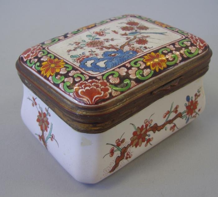 Enamel Porcelain Snuff / Trinket Box, Floral Scene: Enameled porcelain snuff box with a floral motif. Initialed on the underside. Measures 3.5" wide, 2.5" deep and 2" high.