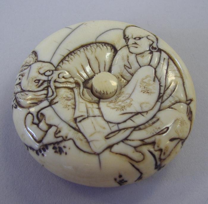 Polychrome Ivory Manju Netsuke, Signed: Measures 2" in diameter and 1/2" thick.