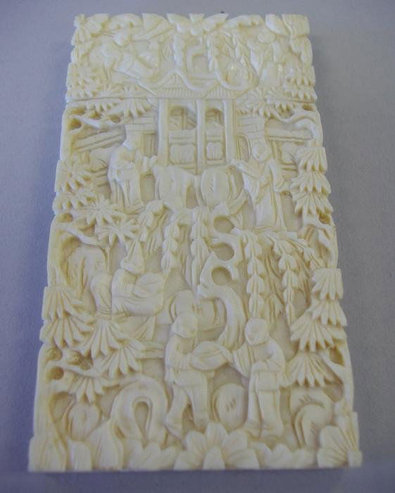 Chinese Carved Ivory Card or Needle Case: Carved on all sides and measuring 3.25" high, 1.75" wide.