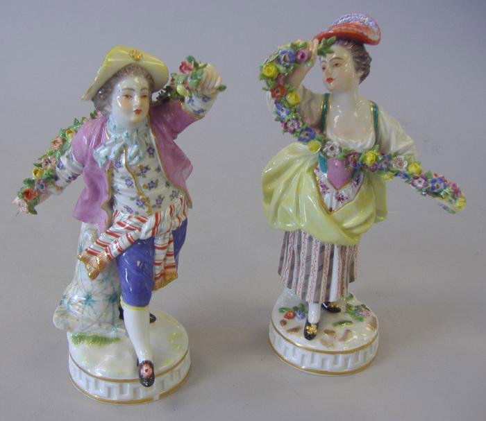 2 Meissen Figures Dancers w/ Garlands of Flowers: Two Meissen porcelain figures of dancers with flowers, Both with the Meissen crossed swords mark. The male measures 6.75" high and has incised numbers 61246, the female, measuring 7" high has incised