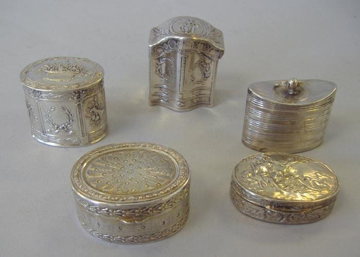5 Continental Silver Pill or Snuff Boxes: Five Continental silver pill or snuff boxes with reposse' and chased designs.