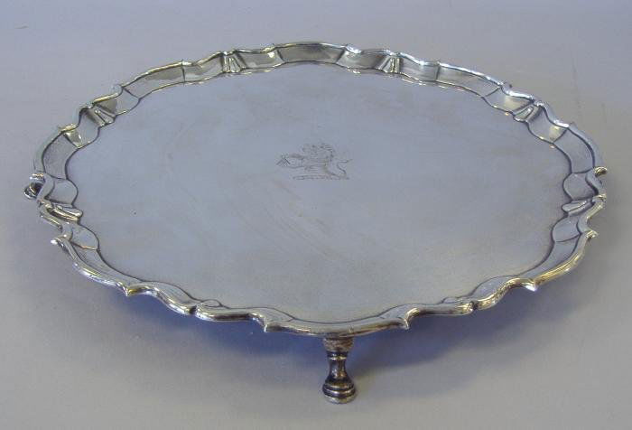 George III Sterling Silver Salver, John Scofield: George III English sterling silver salver measuring 13" in diameter and 1.25" high. Hallmarked for London, 1778. The Maker's mark of either John Scofield or James Stamp (see photo for Hallmarks). This