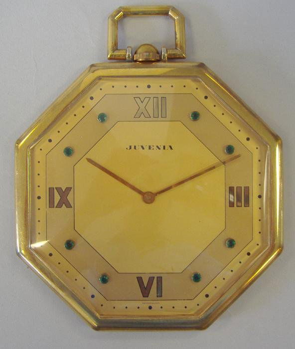 Juvenia Swiss Timepiece, Wall or Desk Clock: Large octagon-shaped timepiece clock by Juvenia. Marked Switzerland. The clock measures 5.75" in diameter. Currently running, although no guarantee of working order.