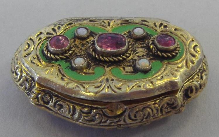 Coppini Gilt Silver Enamel & Tourmaline Pill Box: Gilt silver 800 enameled pill box set with three pink tourmaline faceted stones and four small opals. Stamped on the inside Coppini 800. Measures 1-3/8" x 1/2" x 3/8" high.