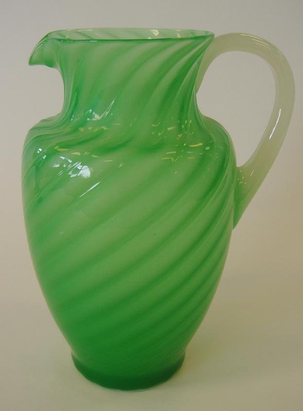 Steuben Jade Green Lemonade Pitcher, #6232, signed: Steuben jade green lemonade pitcher #6232 from Gardner's "The Glass of Frederick Carder". The pitcher measures 9.25" high and has an alabaster handle. Signed on the underside with the acid-etched fleu