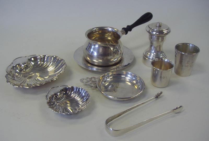 Sterling Shells, Gravy Boat, Toothpick, Tongs +: 9 Sterling silver table articles comprised of 2 sterling shell/nut dishes by Gorham, a shallow porringer and a toothpick holder (both marked B & M Sterling), a pair of English tongs, pepper grinder ma