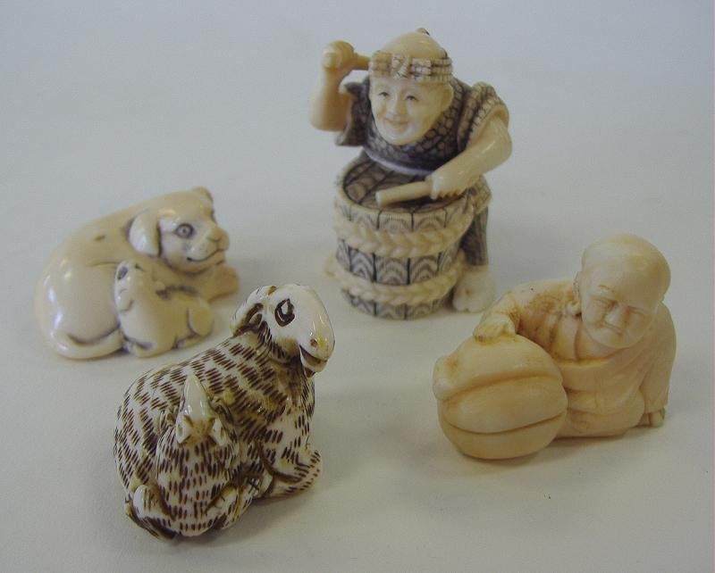 Four Carved Polychrome Ivory Netsukes, signed: Four carved ivory netsukes with polychrome decoration. The drummer and the stag are signed. See photos.