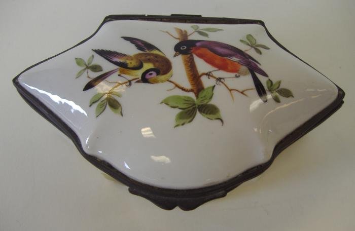 Porcelain & Enamel Snuff or Trinket Box, signed: Porcelain snuff or trinket box with enamels depicting birds within a floral setting. Measures 4.5" x 2.75" and 1.75" high. Initial signed on the underside D.V.