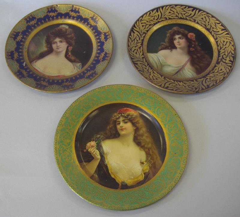 3 Vienna Art Tin Portrait Plates, c.1905: Three tin portrait plates of young women. One signed Vienna Art Plates, Pat. 1905 measuring 10" in diameter. The two other plates each measure 9.5" in diameter.
