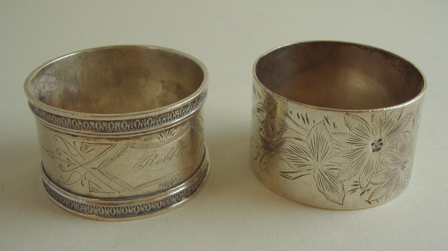 2 Sterling Silver Napkin Rings: Two sterling silver napkin rings with etched designs. One with a three letter monogram and one engraved Robbie. Overall weight, 1.59 troy oz.