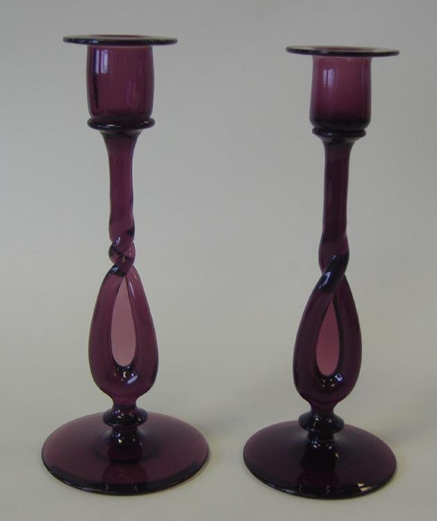 Pair of Amethyst Art Glass Candlesticks: Measuring 10.25" high. Unsigned.