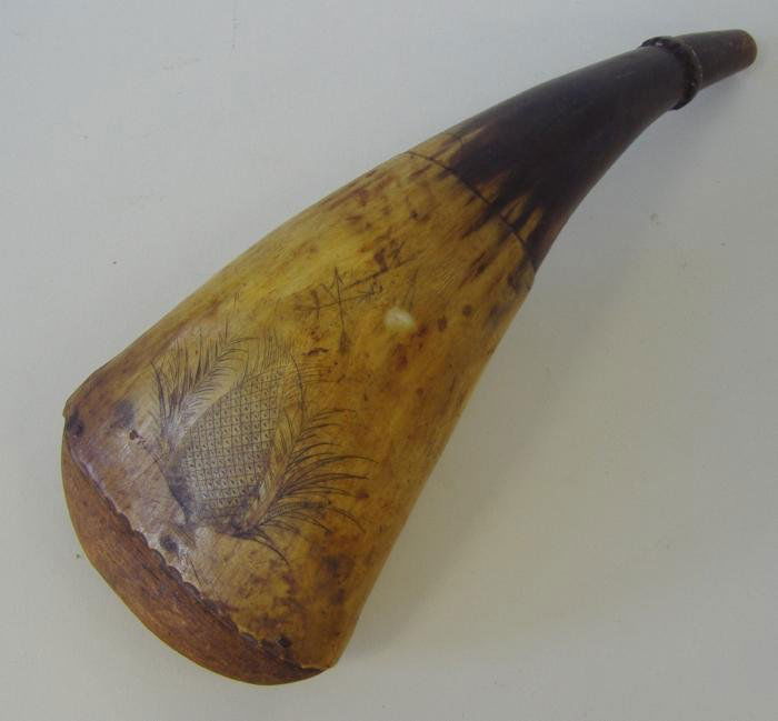 Early Antique Scrimshaw Powder Horn: Early scrimshaw powder horn with a pineapple motif on one side and the initials GT on the other. Measures 8.5" long and 3.5" wide. NOTE: small nick, showing in photos.