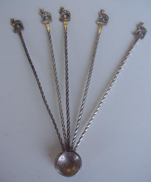 5 Persian Islamic Spoons with Camel Motif: Set of five Persian Islamic silver spoons having a coin-bowl and a camel handle attached to a twisted stem. Overall weight, 70.7 grams.